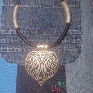 Heart shaped leather or leather like and metal necklace